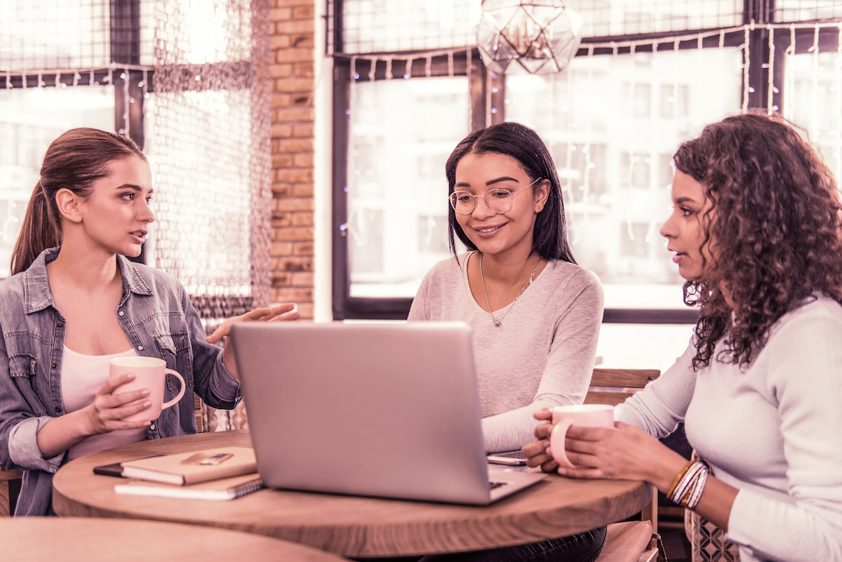 friends discussing finances over coffee