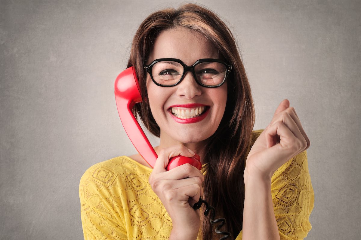 excited woman on phone