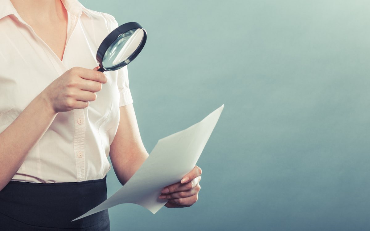 woman inspecting document