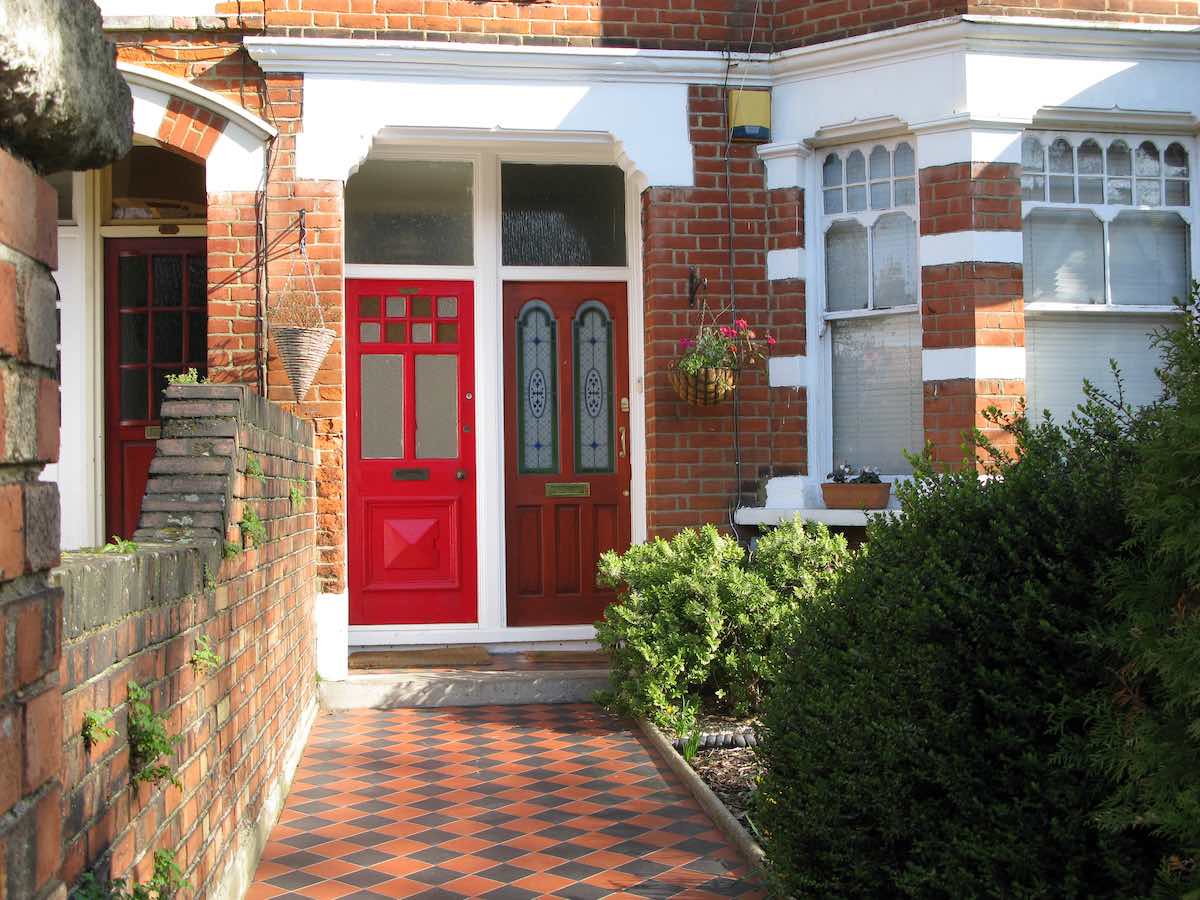 red and black tile front path